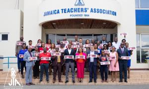 The members of the JTA Central Executive standing on the steps to the 60 yr old JTA organisation at 97B Church Street make a public Statement about teh matter of funding education following a two day fora about urging government to take a second look at the funding of the education sector - All this happened on Friday and saturday, March 21 and 22, 2025