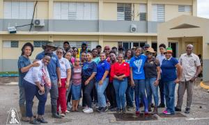  Belmont - The team led by JTA President, Mark Malabver posed for the cameras after presenting care packages to JTA members and  assisting with clean up activities at Belmont High in Westmoreland 